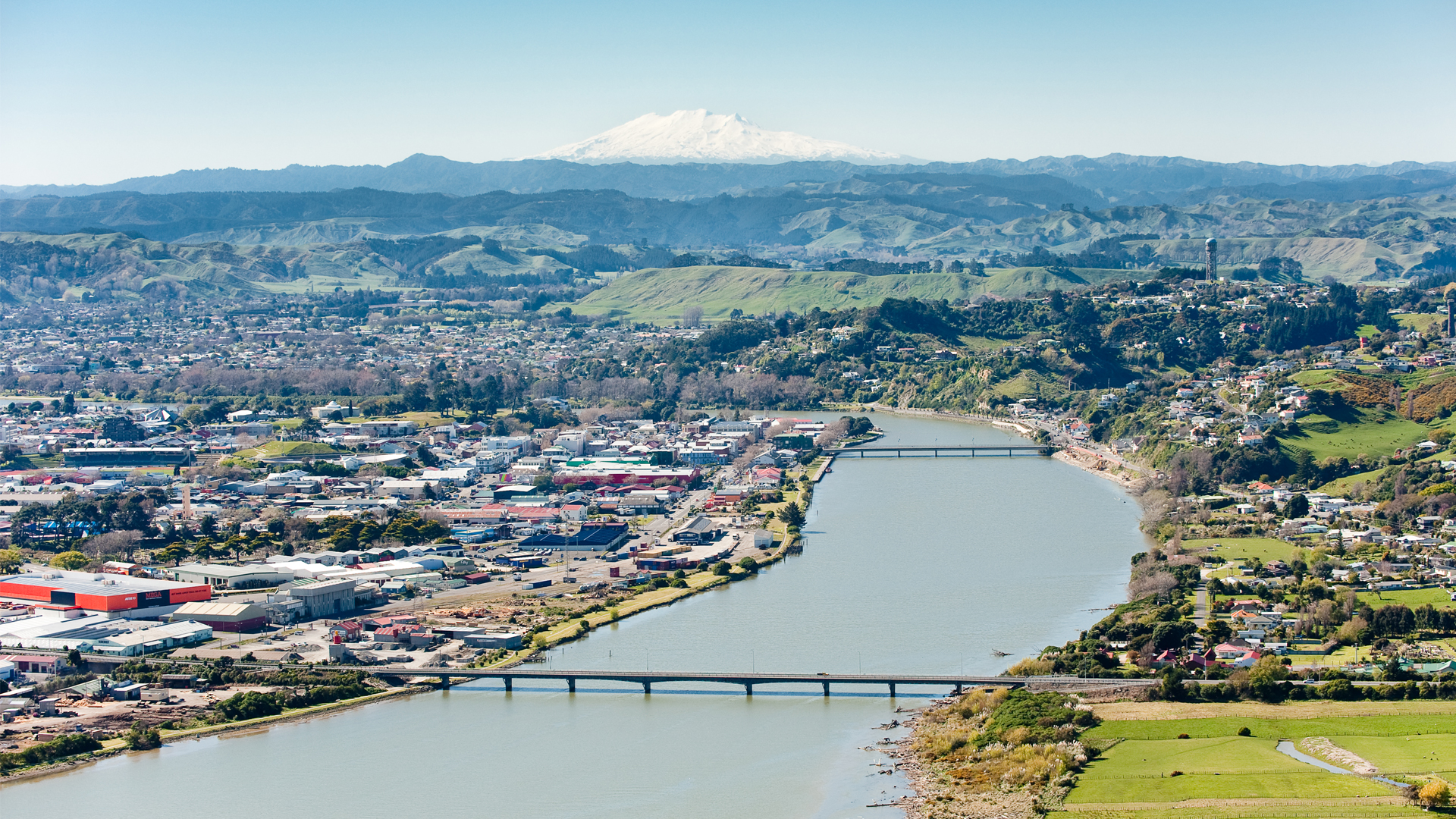 Aerial shot of the Whanganui River with Mount Ruapehu in the distance